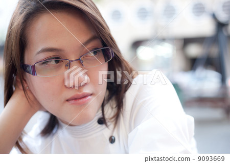 One woman is thinking something. 9093669