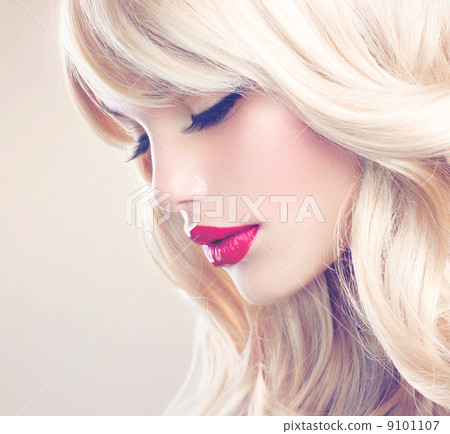 Blonde Woman Portrait. Beautiful Blond Girl with Long Wavy Hair 9101107