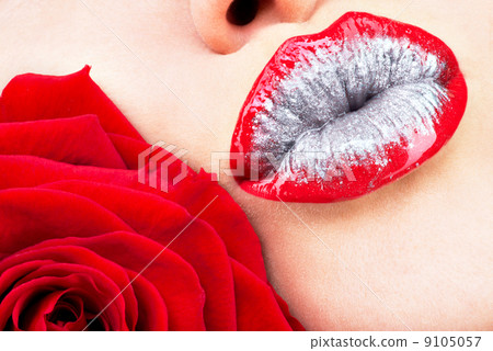 beautiful female lips with shiny  lipstick and red rose 9105057