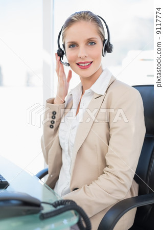 Peaceful blonde call centre agent posing Peaceful blonde call centre agent posing 9117774