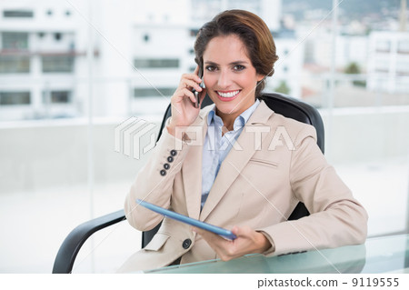 Happy businesswoman calling with smartphone 9119555