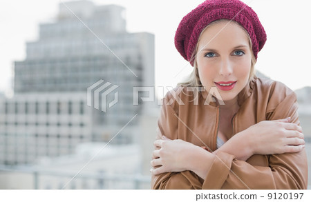 Cold casual blonde posing outdoors 9120197