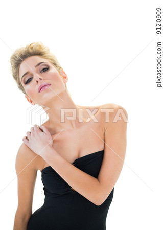 Unsmiling passionate blonde model posing for camera Unsmiling passionate blonde model posing for camera 9120909