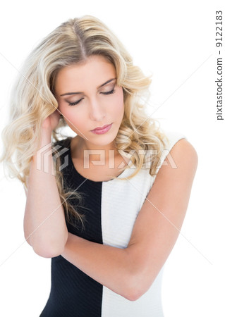 Peaceful blonde model closing eyes 9122183