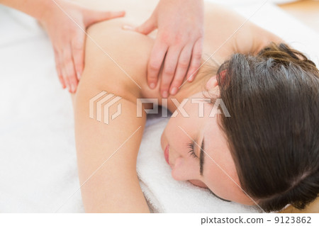 Woman enjoying shoulder massage at beauty spa Woman enjoying shoulder massage at beauty spa 9123862