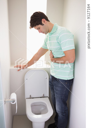 Man with stomach sickness about to vomit into the toile Man with stomach sickness about to vomit into the toile 9127164