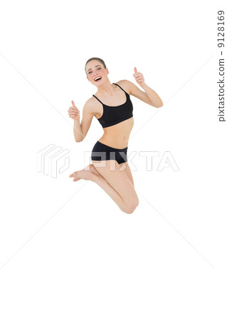 Euphoric slim model jumping in the air Euphoric slim model jumping in the air 9128169