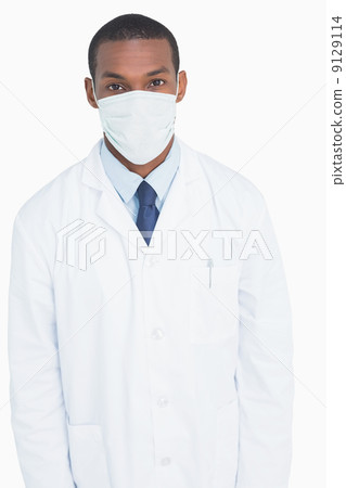 Portrait of a male doctor wearing mask Portrait of a male doctor wearing mask 9129114