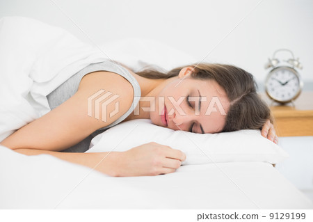 Cute sleeping woman lying in her bed under the cover 9129199