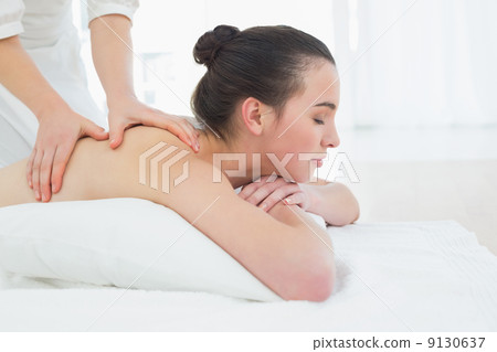 Beautiful woman enjoying back massage at beauty spa Beautiful woman enjoying back massage at beauty spa 9130637