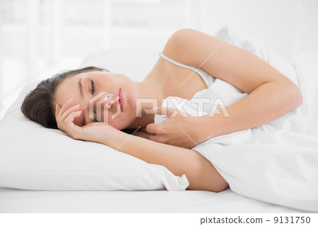 Woman sleeping in bed Woman sleeping in bed 9131750