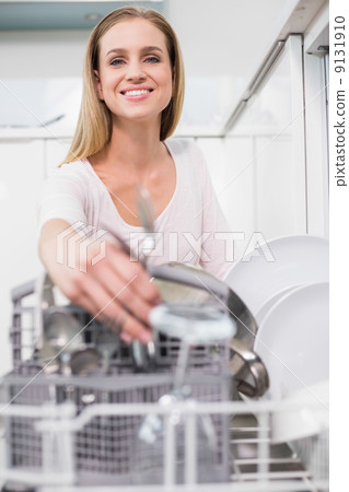 Lucky gorgeous model kneeling behind dish washer Lucky gorgeous model kneeling behind dish washer 9131910