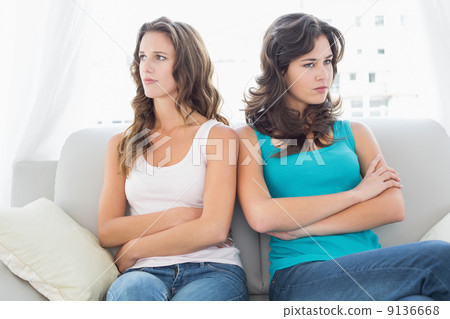 Unhappy friends not talking after argument at home Unhappy friends not talking after argument at home 9136668