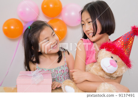 Cute little girls at a birthday party Cute little girls at a birthday party 9137491
