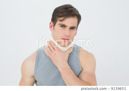 Portrait of a young man wearing cervical collar 9139651