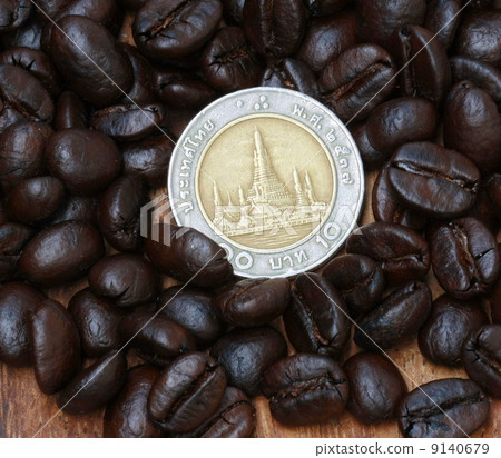10 baht coin(Thai money) and coffee beans 9140679