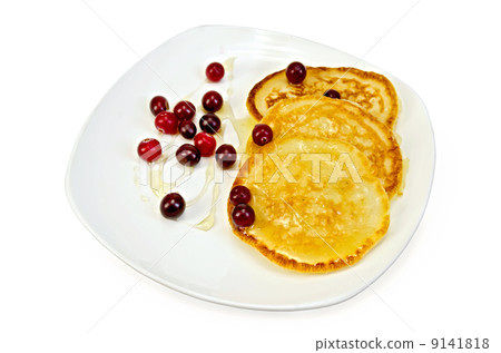 Flapjacks with cranberry and honey in a plate 9141818