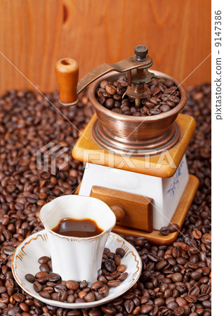 cup of coffee and roasted beans 9147386