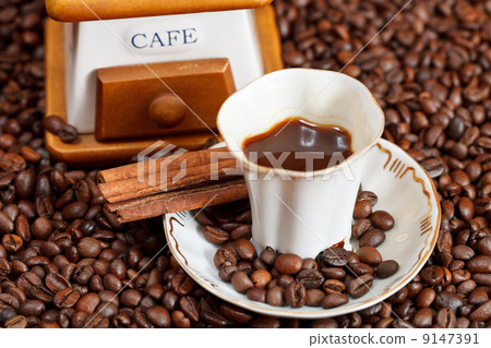 cup of coffee and roasted beans 9147391