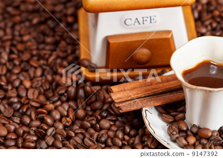 cup of coffee and roasted beans 9147392