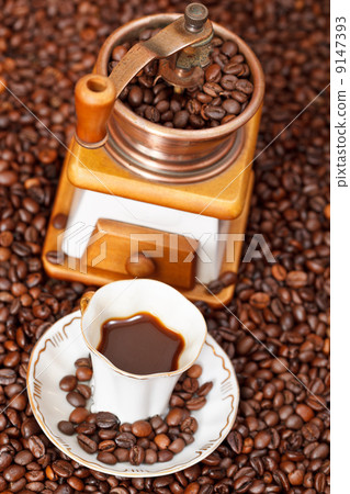 cup of coffee and roasted beans 9147393