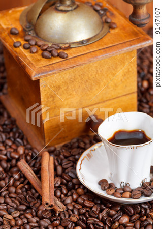 cup of coffee and roasted beans 9147407