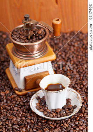 cup of coffee and roasted beans 9147408
