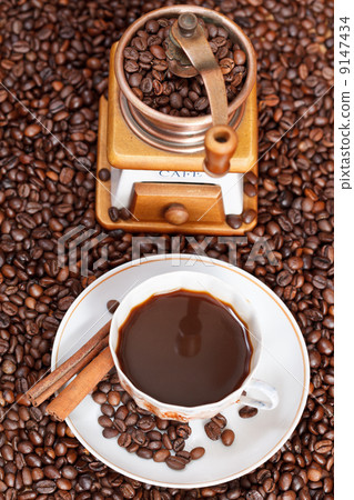 cup of coffee and roasted beans 9147434