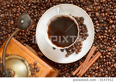 cup of coffee and roasted beans 9147452