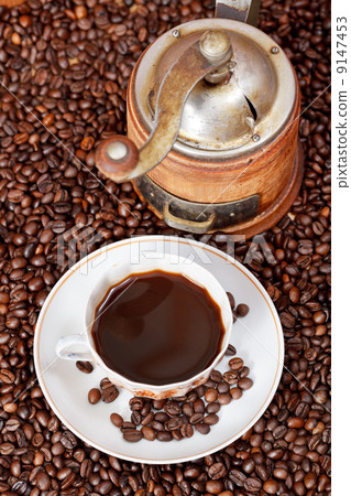 cup of coffee and roasted beans 9147453