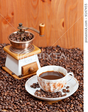 cup of coffee and roasted beans 9147455