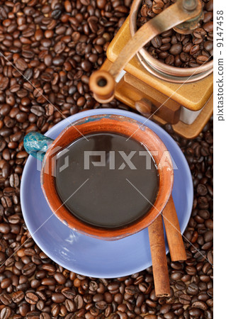 cup of coffee and roasted beans cup of coffee and roasted beans 9147458