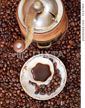 cup of coffee and roasted beans cup of coffee and roasted beans 9147464