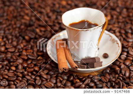 cup of coffee and roasted beans 9147466