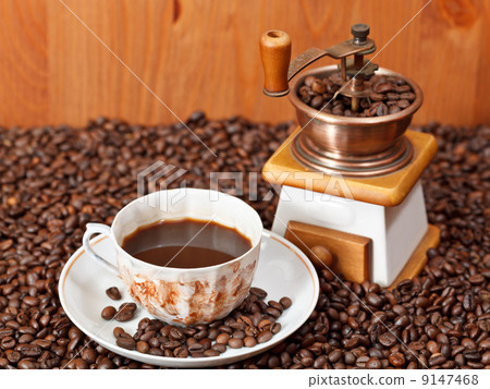 cup of coffee and roasted beans cup of coffee and roasted beans 9147468