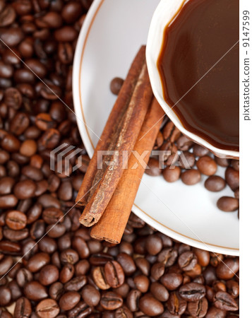 cup of coffee and roasted beans 9147599
