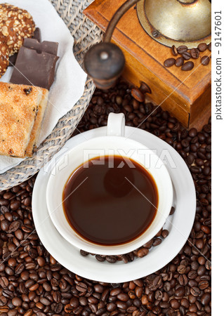 cup of coffee and roasted beans cup of coffee and roasted beans 9147601