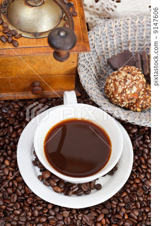 cup of coffee and roasted beans cup of coffee and roasted beans 9147606