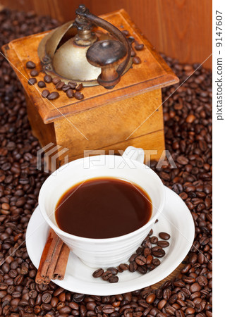 cup of coffee and roasted beans 9147607