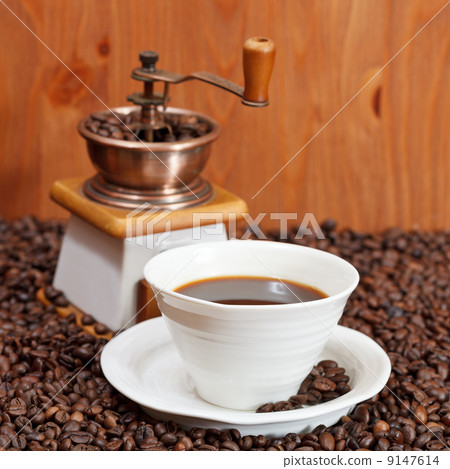 cup of coffee and roasted beans 9147614