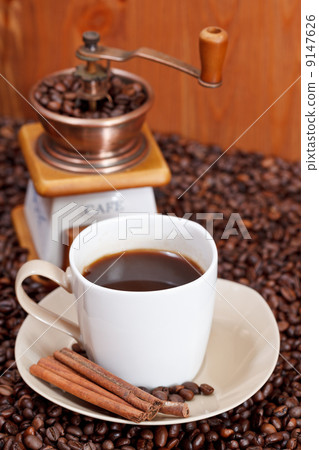 cup of coffee and roasted beans cup of coffee and roasted beans 9147626