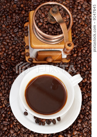 cup of coffee and roasted beans cup of coffee and roasted beans 9147645
