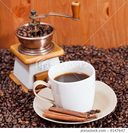 cup of coffee and roasted beans 9147647