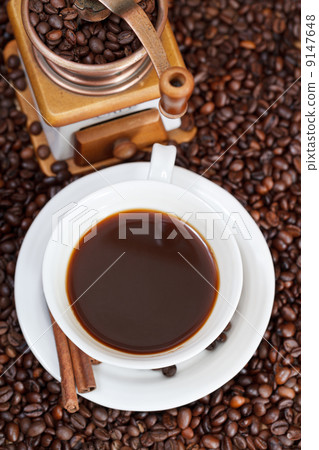 cup of coffee and roasted beans 9147648