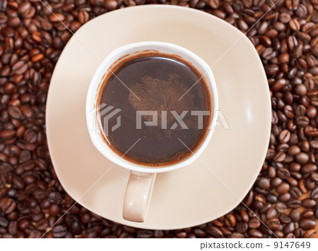 cup of coffee and roasted beans 9147649