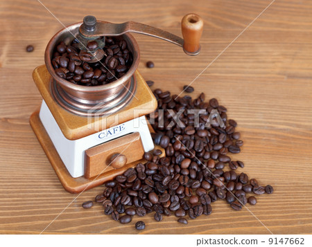 heap of coffee and vintage manual mill 9147662