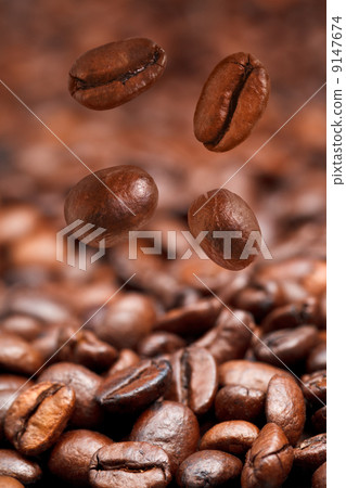 four falling coffee beans and roasted coffee 9147674
