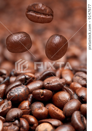 falling beans and dark roasted coffee 9147677