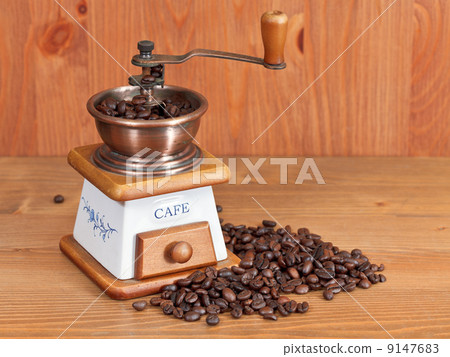 heap of coffee and vintage manual mill 9147683