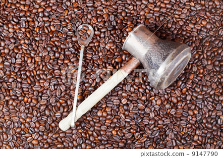 roasted coffee beans and copper pot roasted coffee beans and copper pot 9147790
